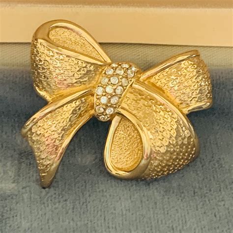 dior brooch pin.